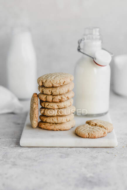 Butter cookies stack with milk — Stock Photo