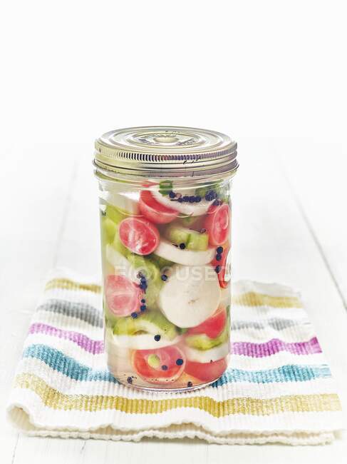 Lacto fermented daikon, radishes, onions, and cucumbers in mason jar — Stock Photo