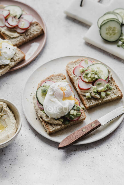 Sandwiches with hummus egg radish and cucumber — Stock Photo