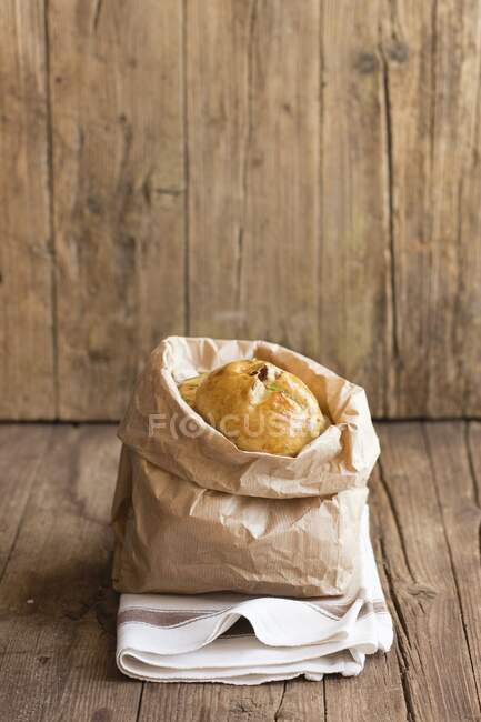 Rosemary bread in a paper bag — Stock Photo