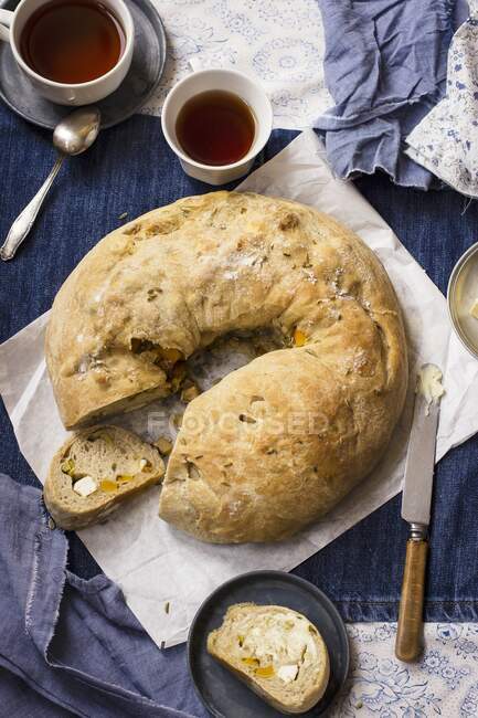 Stromboli with butternut squash, feta and fennel seeds, butter, tea — Stock Photo