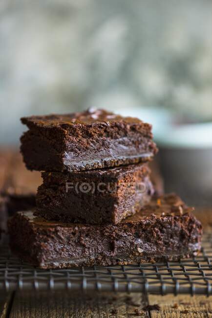 Stacked brownies on a cooling rack — Stock Photo