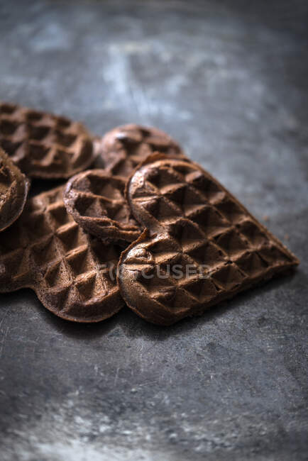 Vegan chocolate waffles on dark surface — Stock Photo
