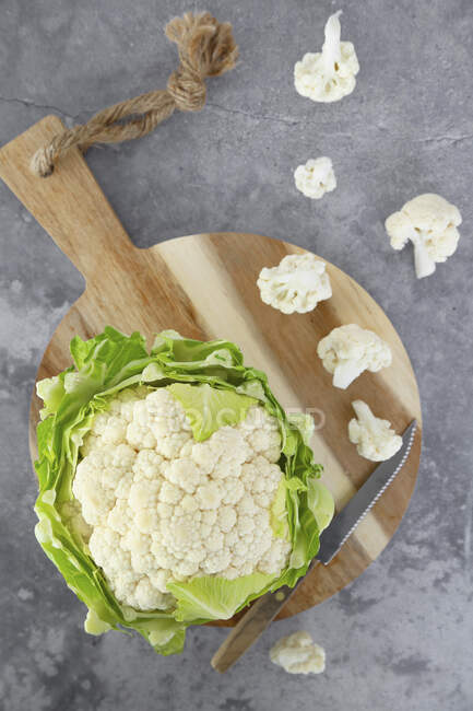 Cauliflower and cauliflower tops — Stock Photo