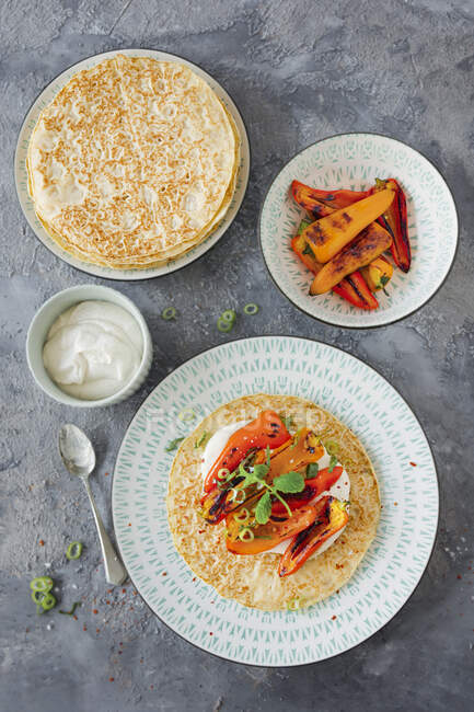 Vegan pancakes with grilled peppers and cashew cream cheese — Stock Photo