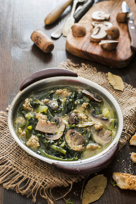 Soup with mushrooms, sausage and kale — Stock Photo