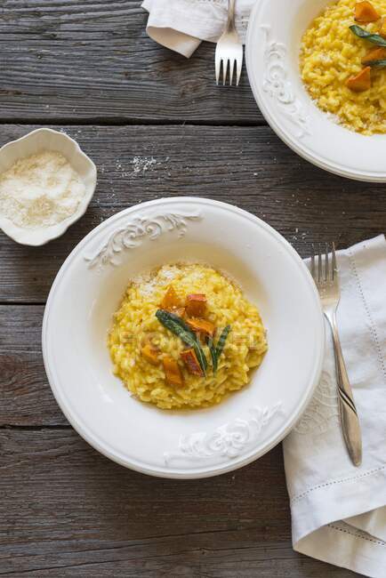 Pumpkin risotto with sage and parmesan — Stock Photo