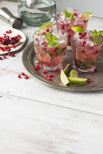 Pomegranate margarita with lime and mint — Stock Photo