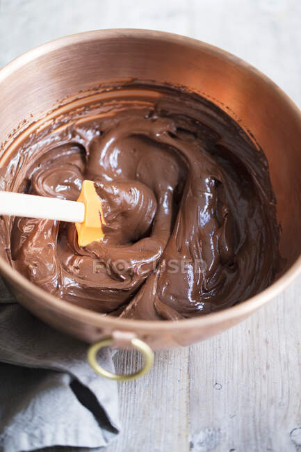 Chocolate cream in a copper mixing bowl — Stock Photo