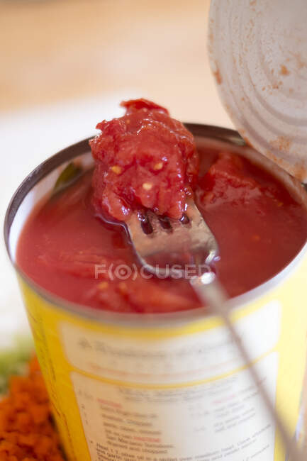 Tinned tomatoes close-up view — Stock Photo