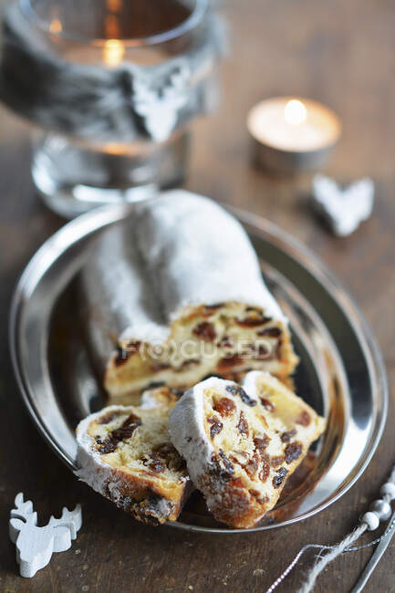 Christmas stollen, sliced, on a small tray — Stock Photo