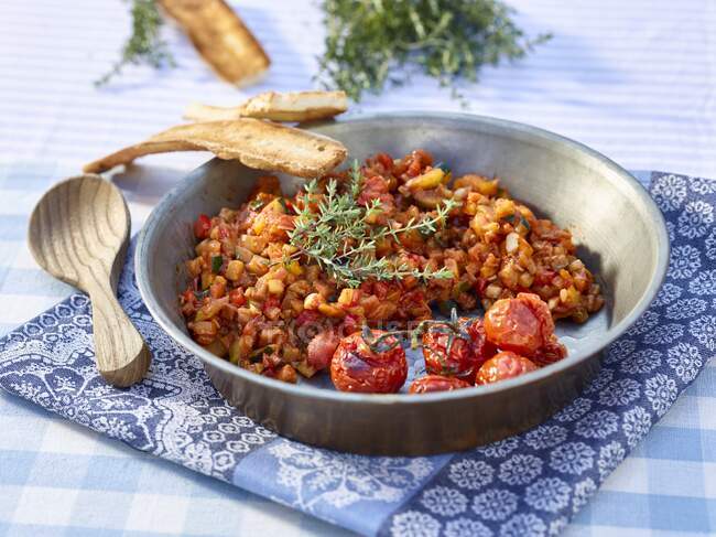 Ratatouille with oven-baked tomatoes and thyme — Stock Photo