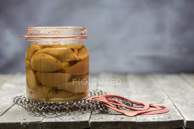Preserved pears in a glass jar — Stock Photo