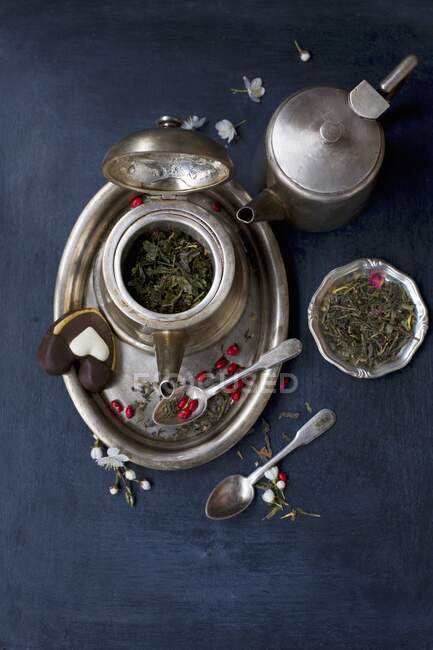 Silver tea set on a blue background — Stock Photo