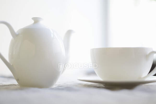 A place setting for coffee with a coffee pot — Stock Photo