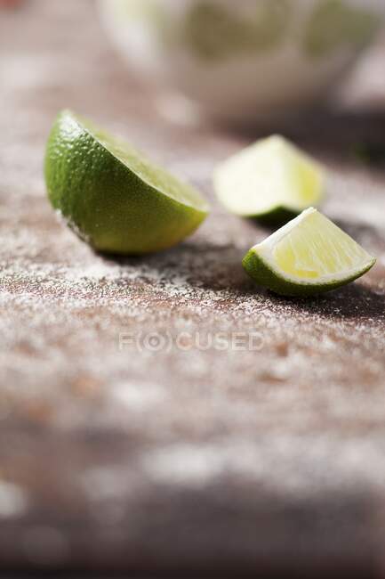 Limes, quartered close-up view — Stock Photo