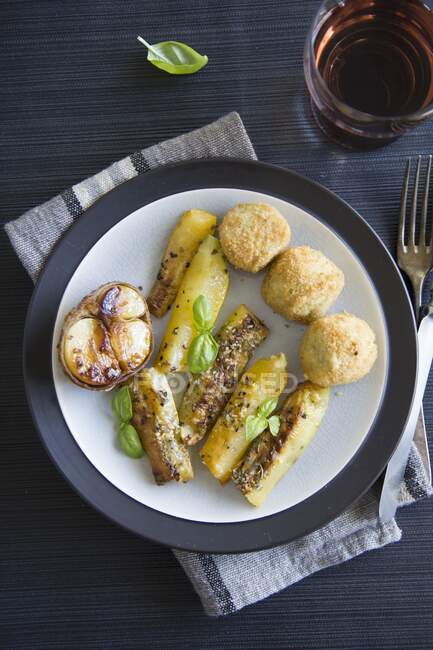 Fried courgette with potato croquettes — Stock Photo