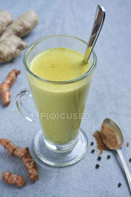 Golden turmeric milk close-up view — Stock Photo
