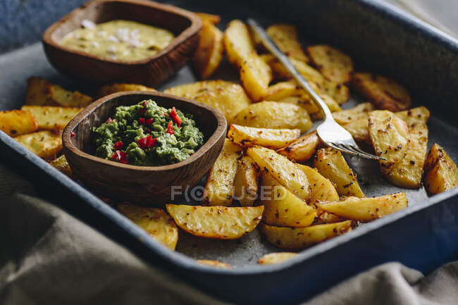 Tasty baked potatoes, closeup view on table. — Stock Photo
