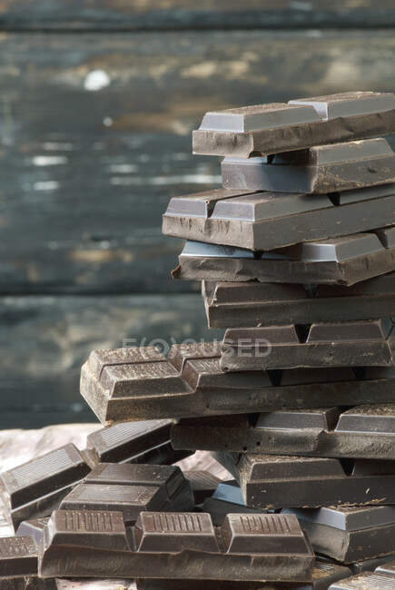 Stacked squares of chocolate — Stock Photo