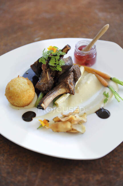 Lamb chops with various sides — Stock Photo