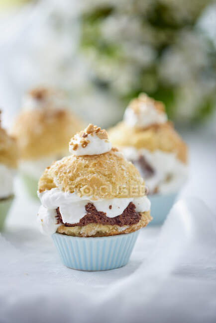 Profiteroles with chocolate filling and orange blossom essence — Stock Photo