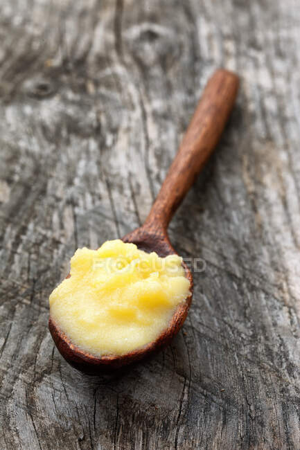 Ghee on a wooden spoon — Stock Photo