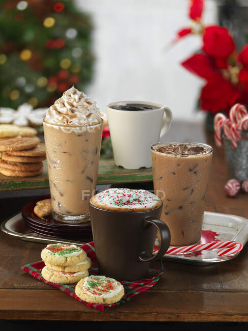 Four different wintery coffee drinks — Stock Photo