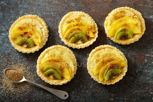 Exotic fruit tartlets top view — Stock Photo