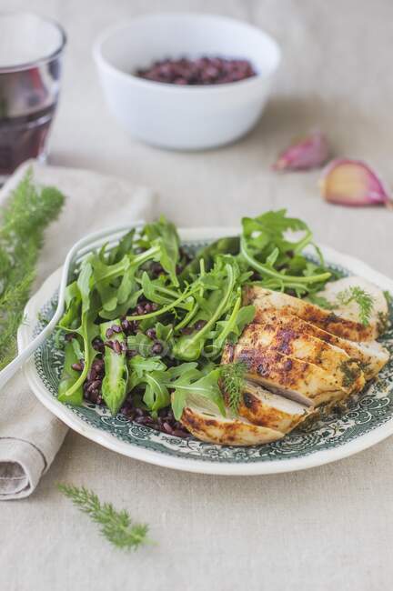 Close-up shot of delicious Chicken breast with rocket salad — Stock Photo