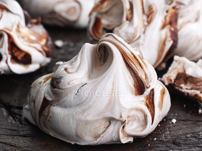 Giant meringue on a wooden background — Stock Photo