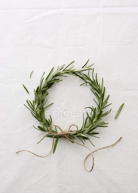 A wreath of rosemary sprigs against a white background — Stock Photo