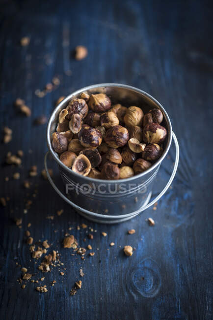 Roasted and sliced hazelnuts in the basket — Stock Photo