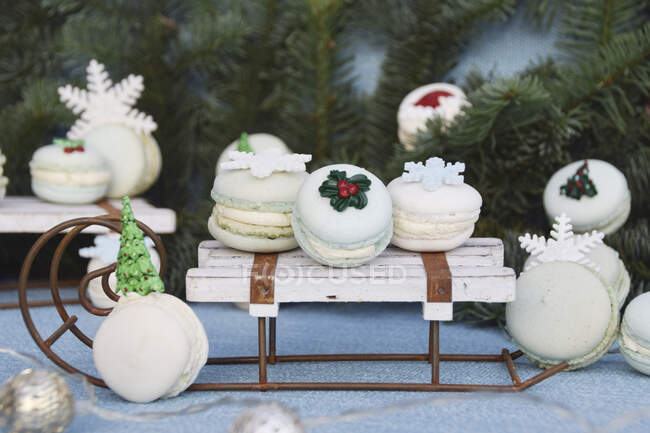 Winter macarons on a decorative sledge — Stock Photo