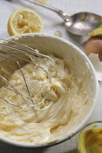 Mayonnaise being stirred in a bowl — Stock Photo