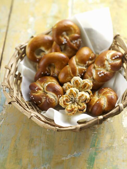Lye bread rolls in a bread basket — Stock Photo