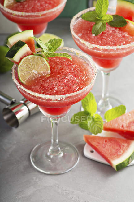Frozen watermelon margaritas with lime and mint — Stock Photo