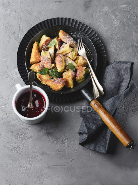Kaiserschmarren (sweet cut up pancakes) with cherry compote — Stock Photo
