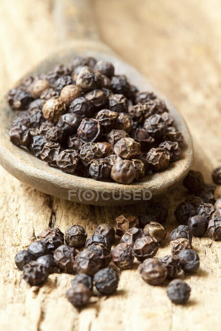 Dried black peppercorns close-up view — Stock Photo
