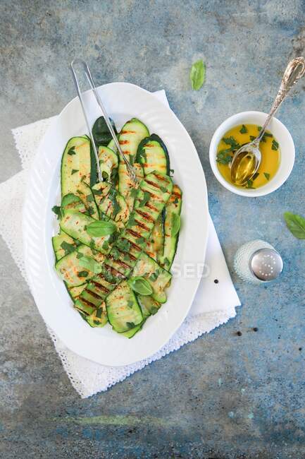 Grilled zucchini with parsley and basil — Stock Photo