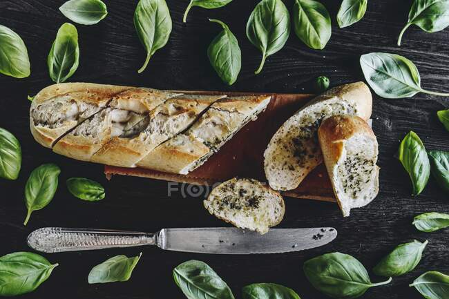 A baguette with herb butter — Stock Photo