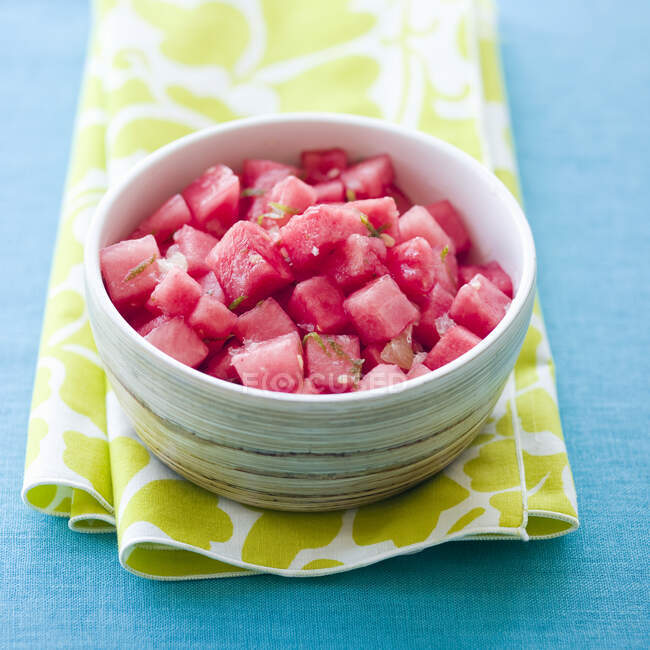 Watermelon salad with lime dressing and zest in bowl — Stock Photo