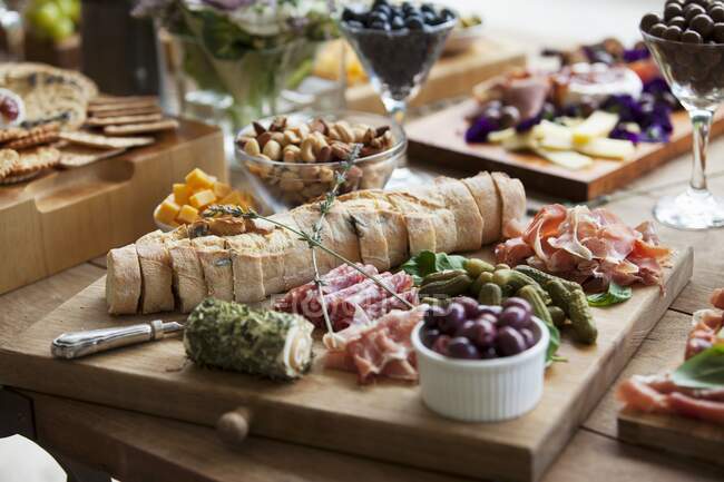 Various party snacks on a wooden table — Stock Photo