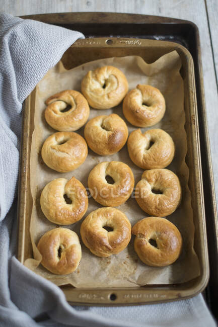 Mini bagels on a baking tray — Stock Photo