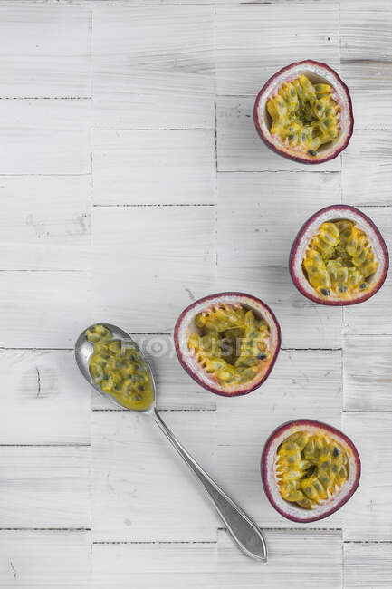 Passion fruits on white wooden background — Stock Photo