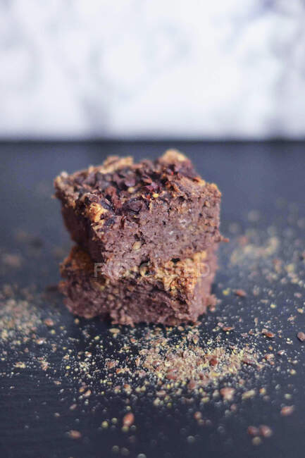 Chocolate Brownie on blurred background — Stock Photo