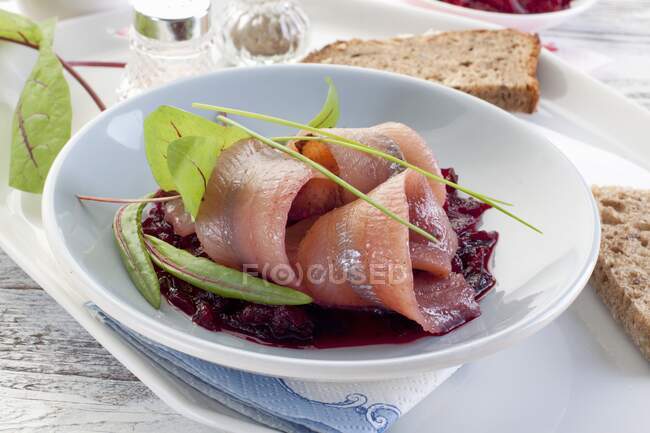Marinated herring fillets with beetroot — Stock Photo
