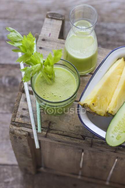 Pineapple and celery smoothies with cucumber — Stock Photo