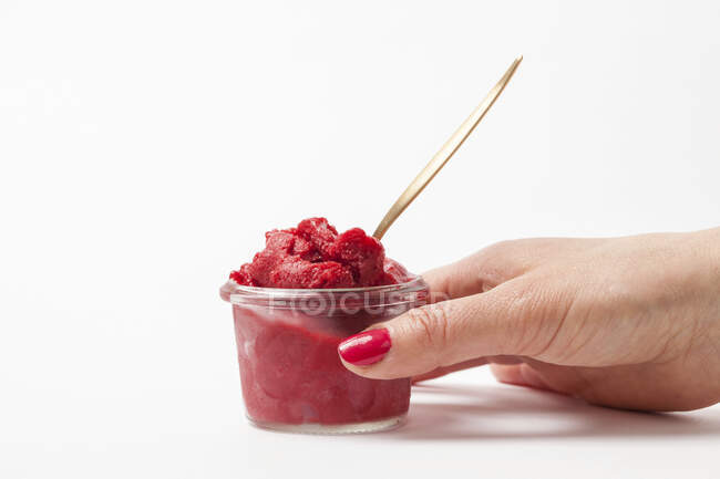 Berry ice cream in a glass with a spoon — Stock Photo