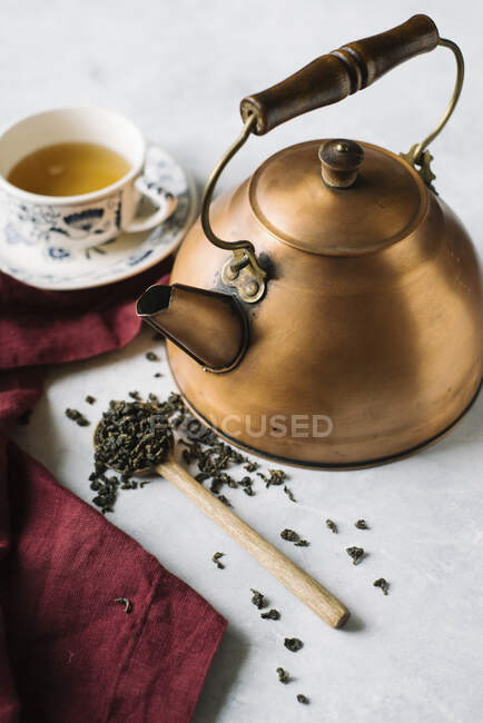 Green tea in a copper pot and a tea cup — Stock Photo